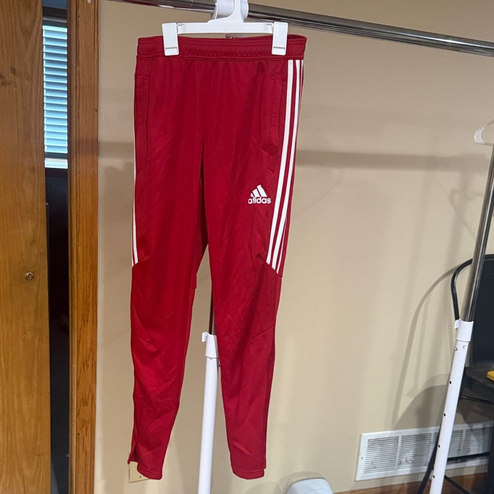Adidas
Red Joggers with White Stripes